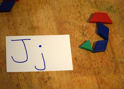 Teach letters using pattern blocks as a teaching resource. 