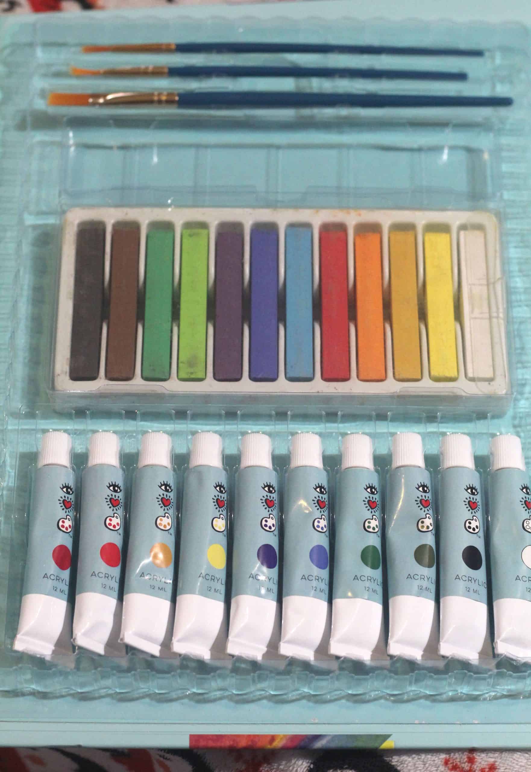 Art set with a variety of paints and pastels