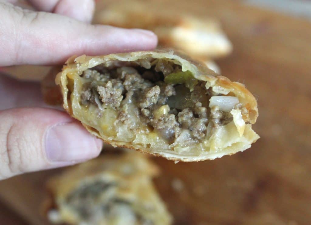 Missing the Disney parks? This Cheeseburger Egg Roll recipe is EASY and is a little taste of Disney you can make at home for your family! This easy recipe is the perfect appetizer or dinner recipe kids are sure to enjoy while parents will love them too! #Recipe 