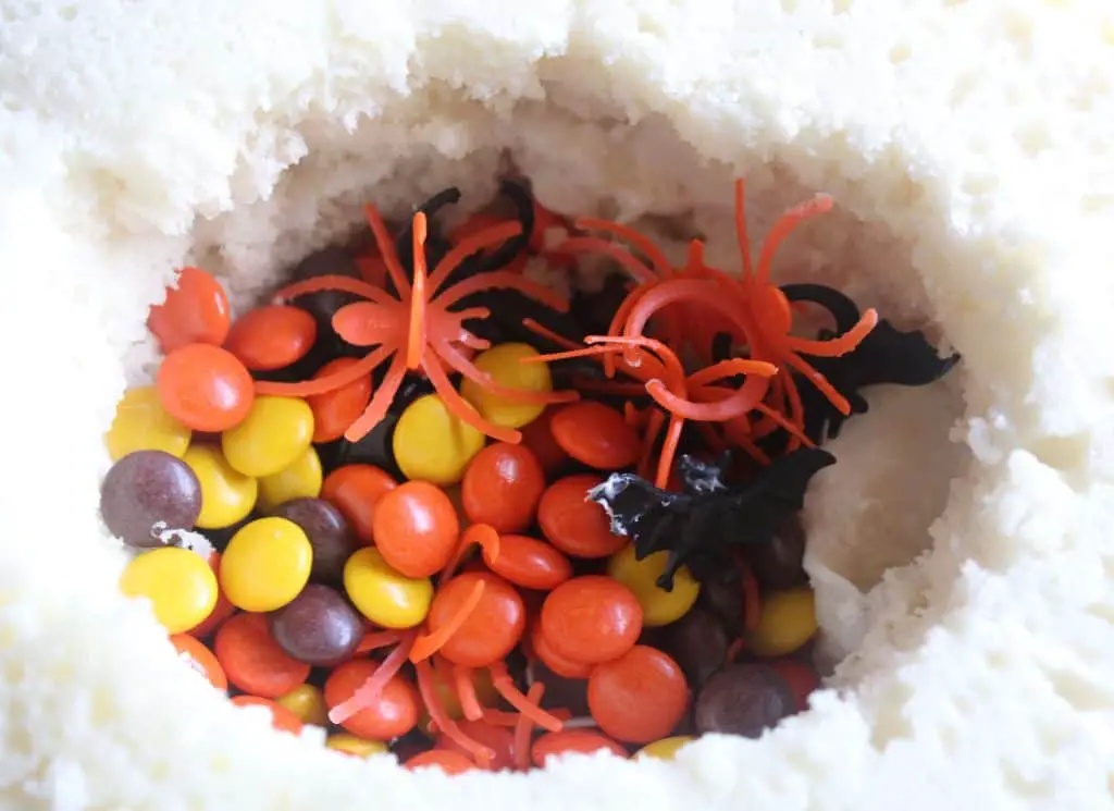 This Halloween Pinata Cake Recipe is an easy pinata cake recipe anyone can make! Learn how to make a pinata cake while making a great treat!